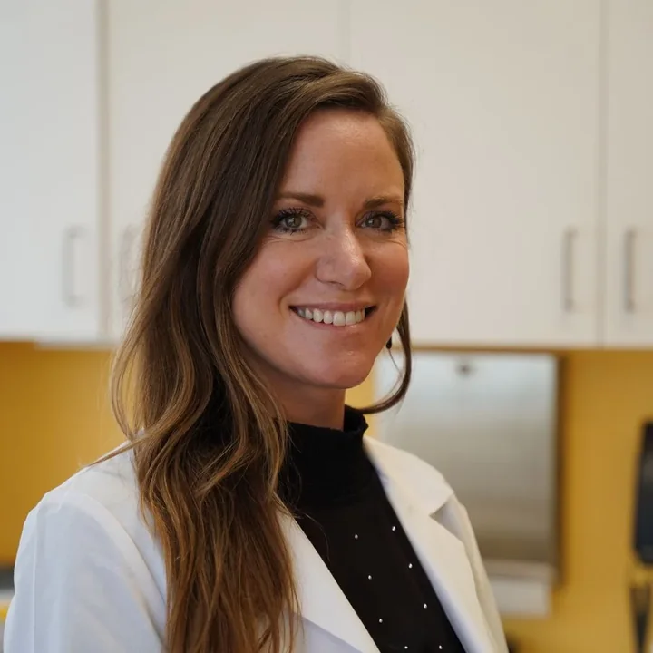Dr. Jennifer Davidson, CellScience medical advisor, in her white coat at the clinic